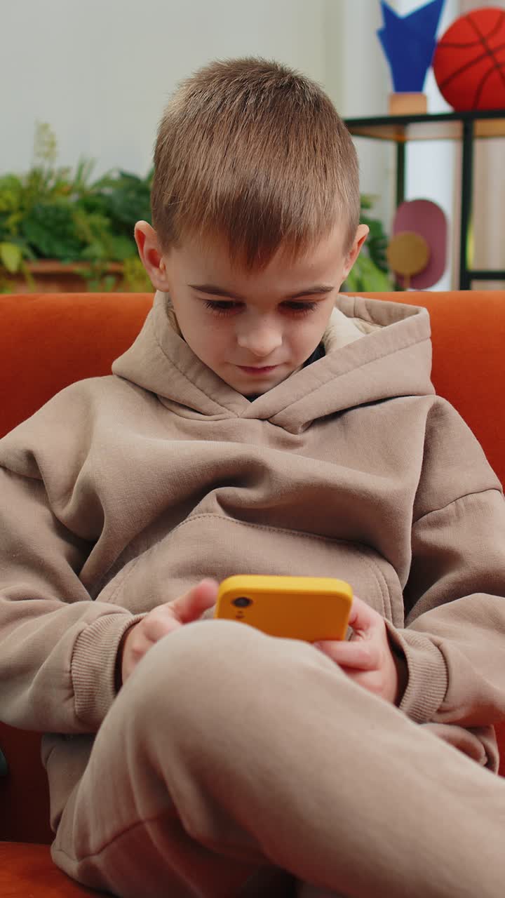 Child kid boy use smartphone playing game loses surprised lottery result fail education study test