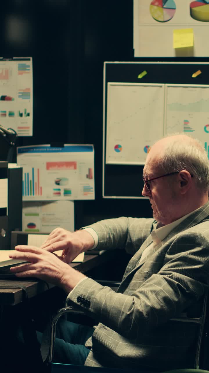 Vertical Video Wheelchair user analyzes geographical maps for crime scene reconstructions