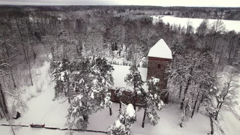 old stone church in latvian country side, winter time