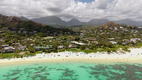 drone shot of lanikai beach, oahu island, hawaii. white sand and homes in kalua