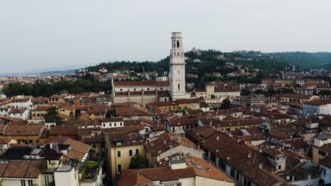 aerial view pushing towards the torre dei lamberti tower in verona, italy