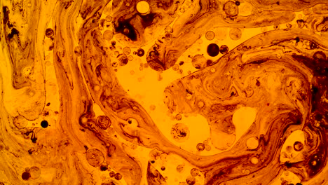 Colorful oil drops floating on water surface, top view. Fantastic abstract background. Bright bubbles moving and spreading. Close up 4k video of weird liquid structures. Scientific chemical experiment