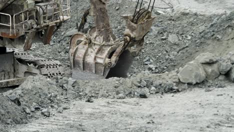 excavator in operation at a quarry site