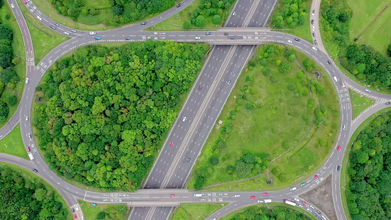 Drone birds-eye static view of a busy motorway junction