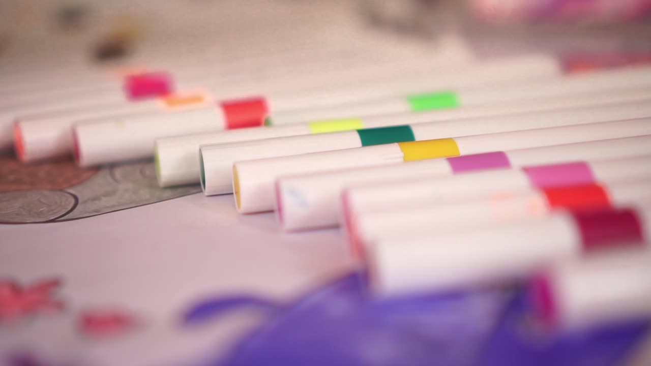 Set of colorful markers arranged neatly on surface. Art supplies for kids, students, and creative projects