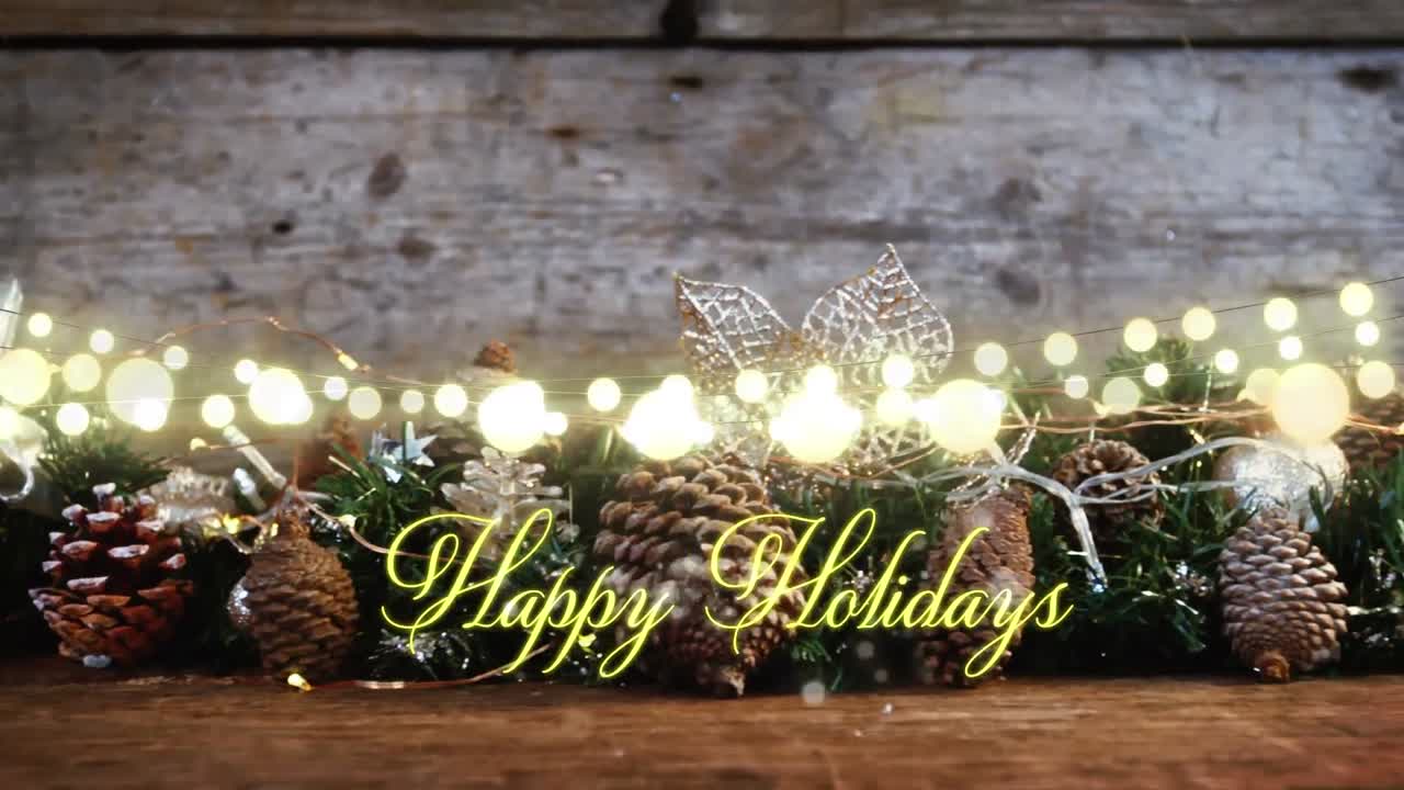 Animation of text, happy holidays, in yellow, over string lights and seasonal decorations