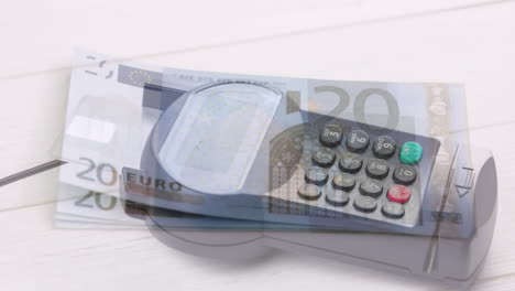 animation of euro banknotes falling over payment terminal