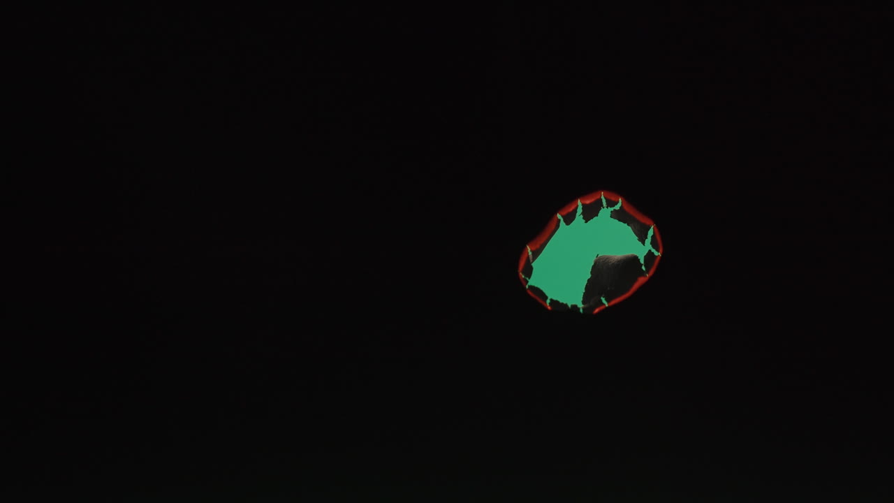 Green Hole in Dark Background