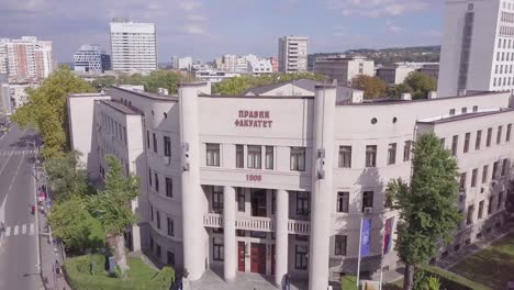 slow stunning orbiting aerial shot of law faculty, university of belgrade, serbia