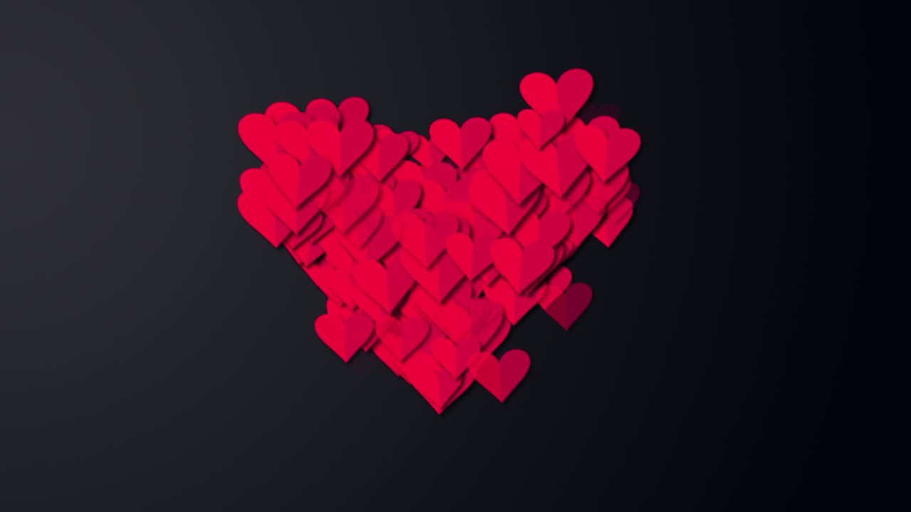 pequeños corazones rojos en un gran corazón rojo en pantalla negra