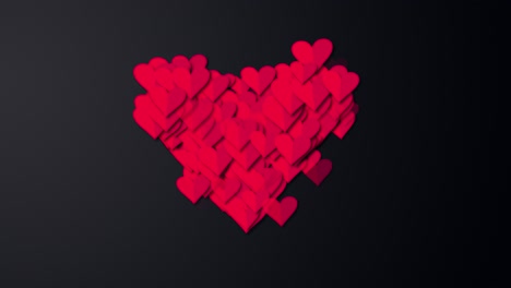 small red hearts into big red heart on black screen