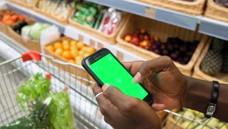 person shopping at grocery store with smartphone