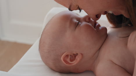 close-up-mother-kissing-baby-laughing-enjoying-loving-mom-nurturing-her-toddler-showing-love-at-home
