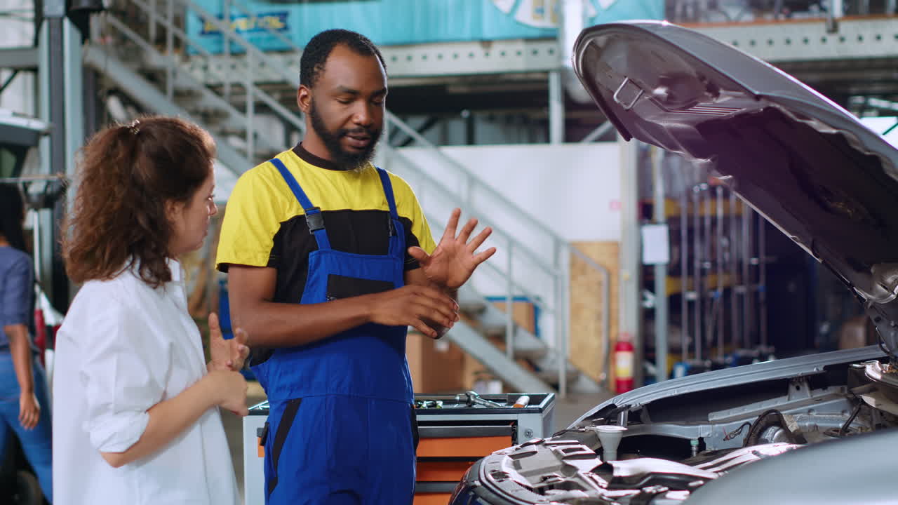 Employee showing client car damages