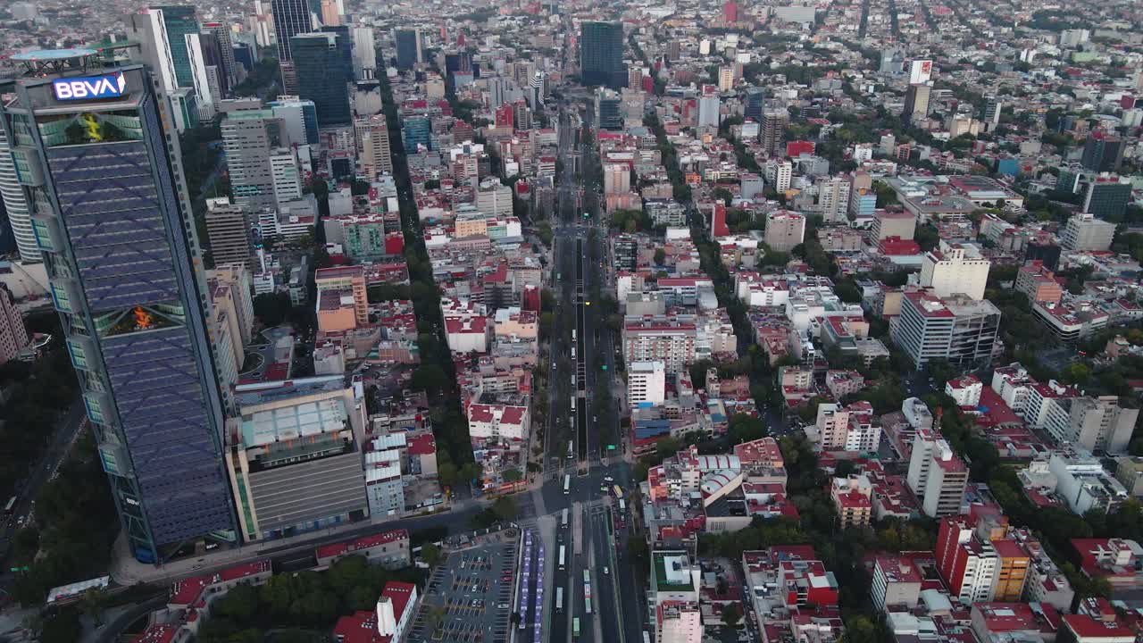 Aerial view of the BBVA tower and the Avenue Sorona street, in Juarez, Mexico city, in Central America - dolly, drone shot