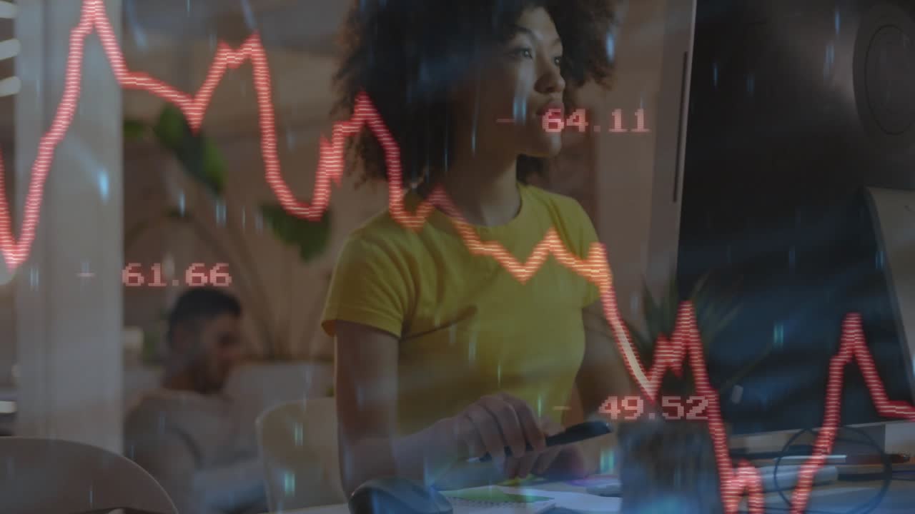 Woman picking stylus and drawing on tablet while red line chart fluctuating for financial review