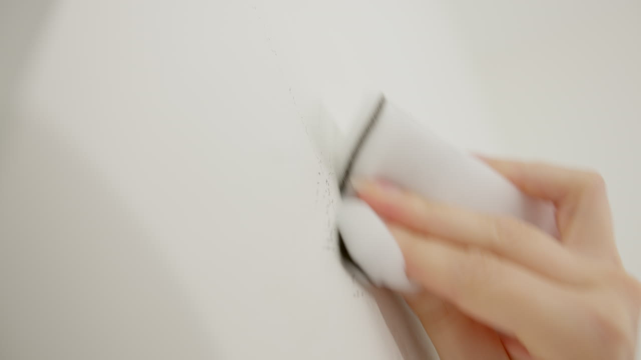 Cleaning The Wall With White Sponge - Close Up