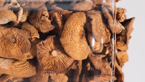 closeup of a jar of dried mushrooms spinning in a circle dry mushrooms closeup of a jar of dried mushrooms spinning in a circle dry mushrooms