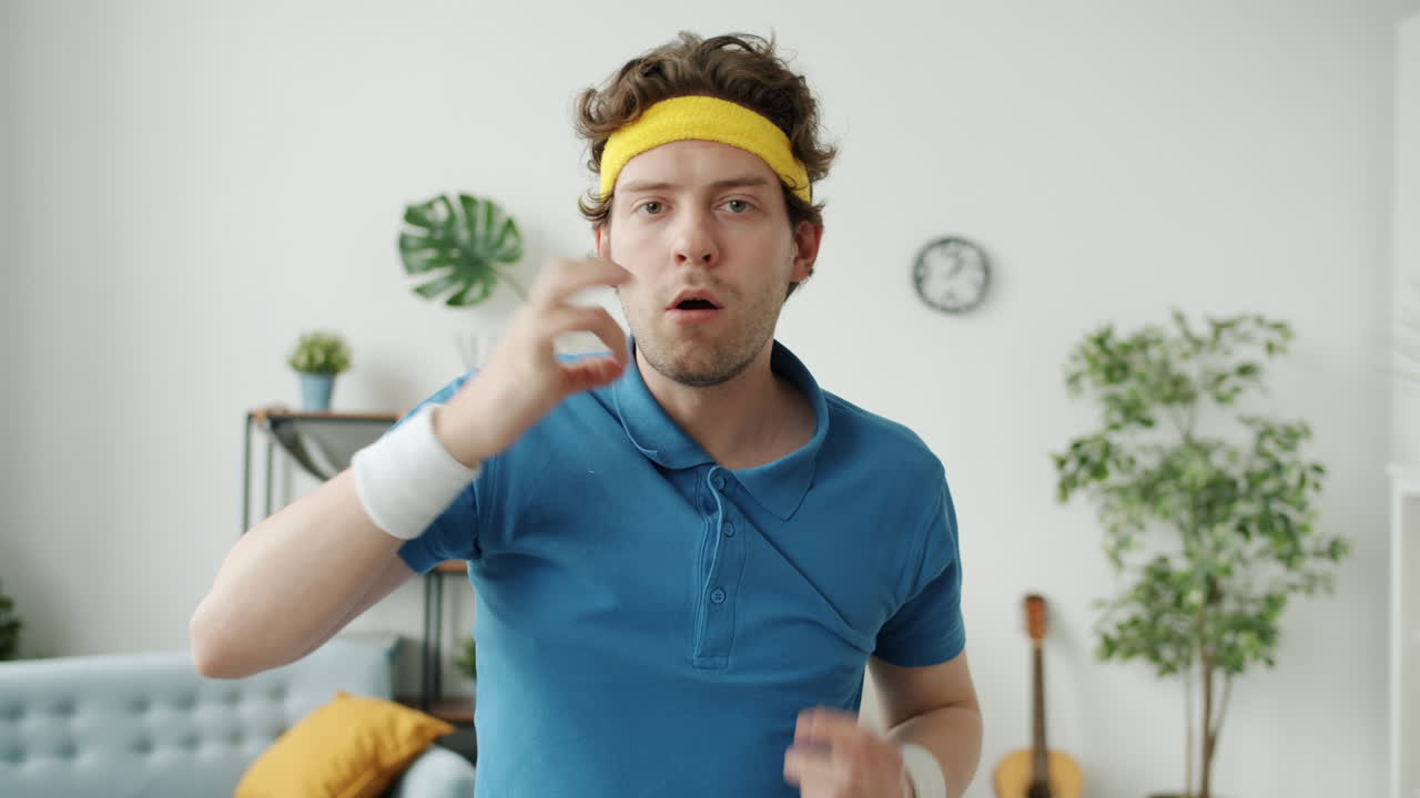 Man in retro sports outfit, looking exhausted