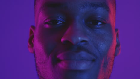 close-up portrait of a man with vibrant lighting