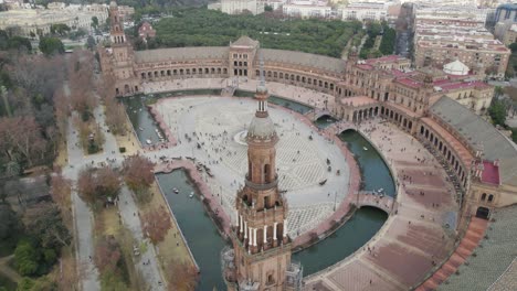 people at spain square or plaza de espana in maria luisa park, seville in spain