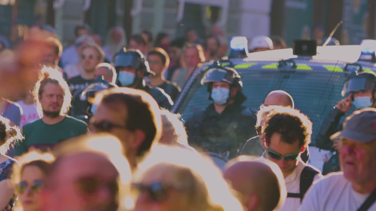 Crowd of people and police officers