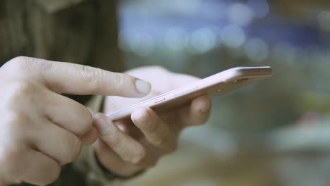 man using smartphone on metro station