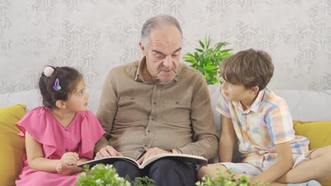 grandfather and grandchildren are looking at the comic book.