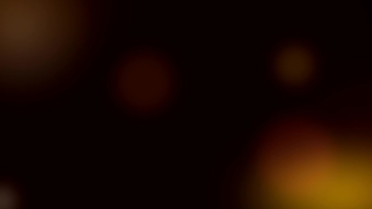 Yumuşak Parlayan Altın ve Kırmızı Bokeh Işıkları İçeren Soyut Arka Plan