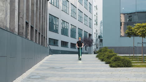 man riding electric scooter in city street