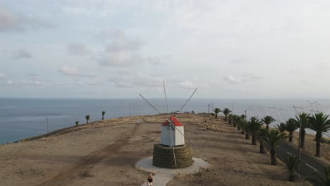 scenic hill at porto santo view of ocean and famous windmills, aerial