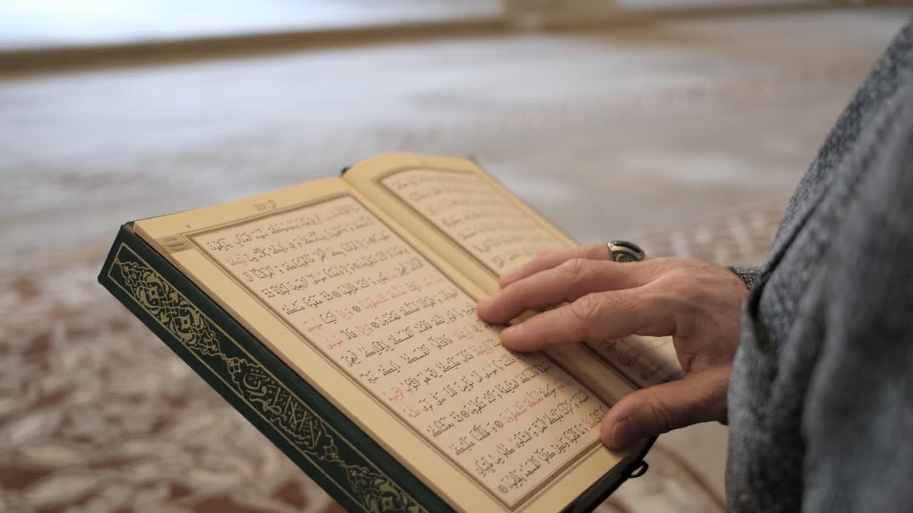 Premium Stock Video - Reading Arabic Quran