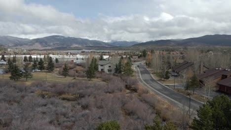 aerial dolly shot above a neighborhood with lake dillon in the distance