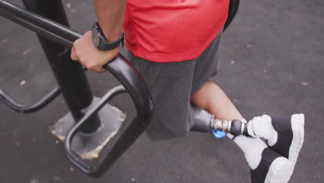 Side-view-man-with-prosthetic-leg-exercising