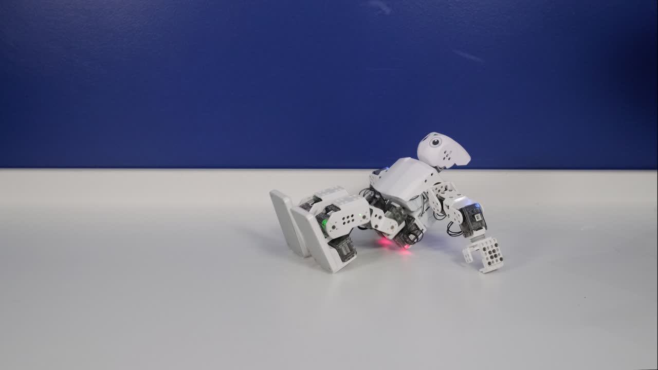 Small White Robot Performing Movements
