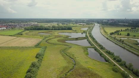 aerial drone view of the beautiful canal maxima and green landscape in the netherlands europe