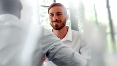businesspeople interacting with each other while having breakfast