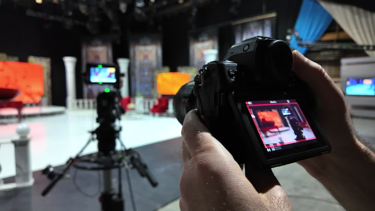 Professional camera filming on the backstage of a TV set