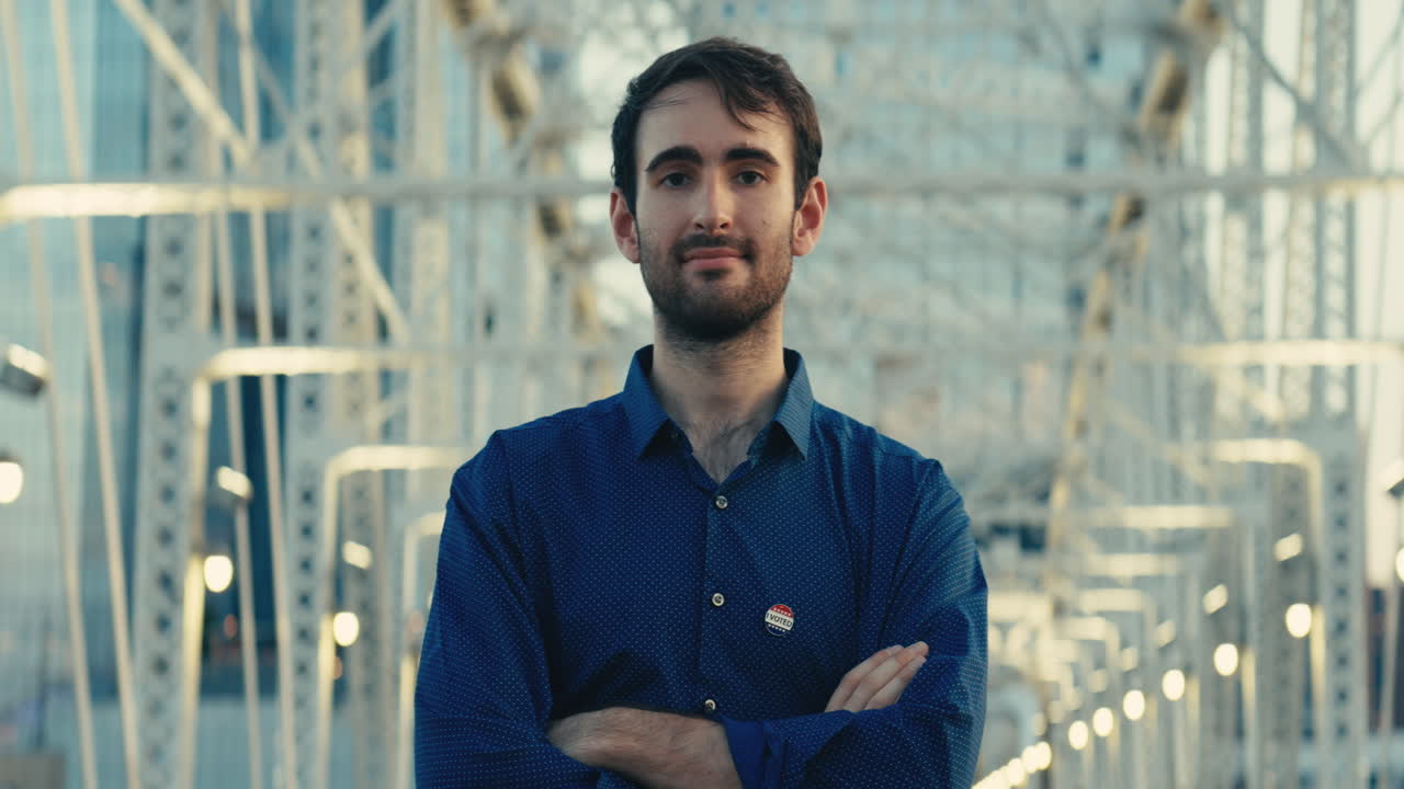 Man with I Voted sticker on bridge