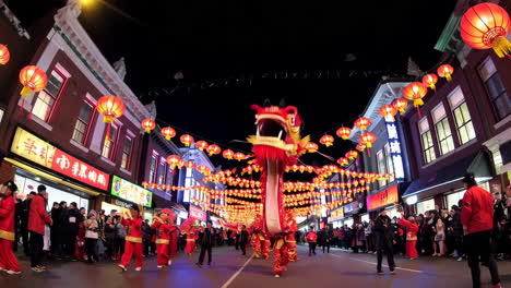 chinese new year dragon dance parade at night in chinatown