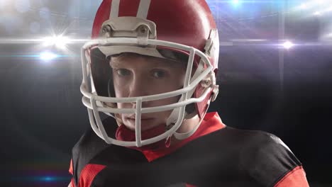 animation of lights over american football player in helmet at floodlit stadium