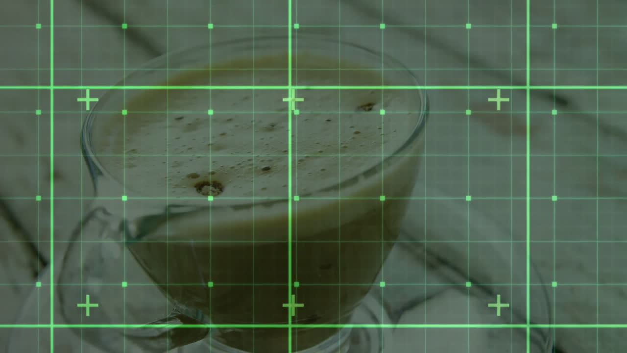 Transparent glass coffee cup being rendered in 3D with frothy beverage and green grid overlay