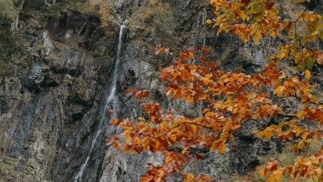 autumn waterfall in mountainous terrain