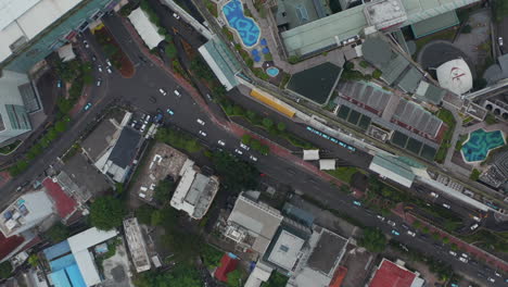 Aerial-Birds-Eye-Overhead-Top-Down-View-closing-in-on-dense-street-car-traffic-in-city-neighborhood-in-Jakarta,-Indonesia