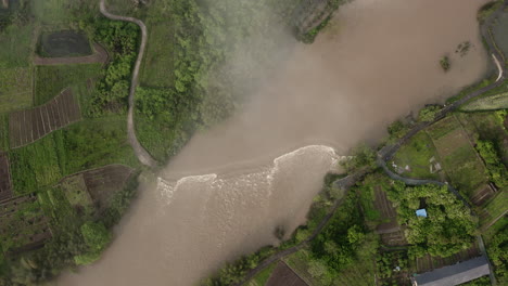 Yulong-river-flowing-through-China-remote-countryside,-aerial-bird's-eye-view