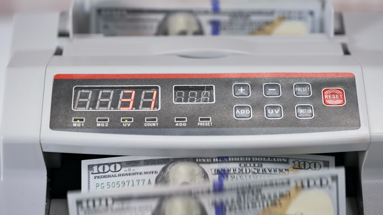 Money counting equipment for paper money calculation. US national paper currency. Automatic mechanism for bank financial operations.