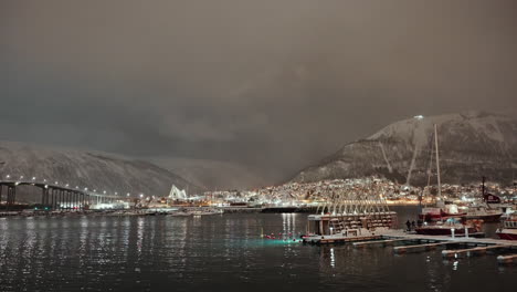 Static-shot-of-Tromso-harbor-ijn-nighttime-above-the-Arctic-circle-in-Norway