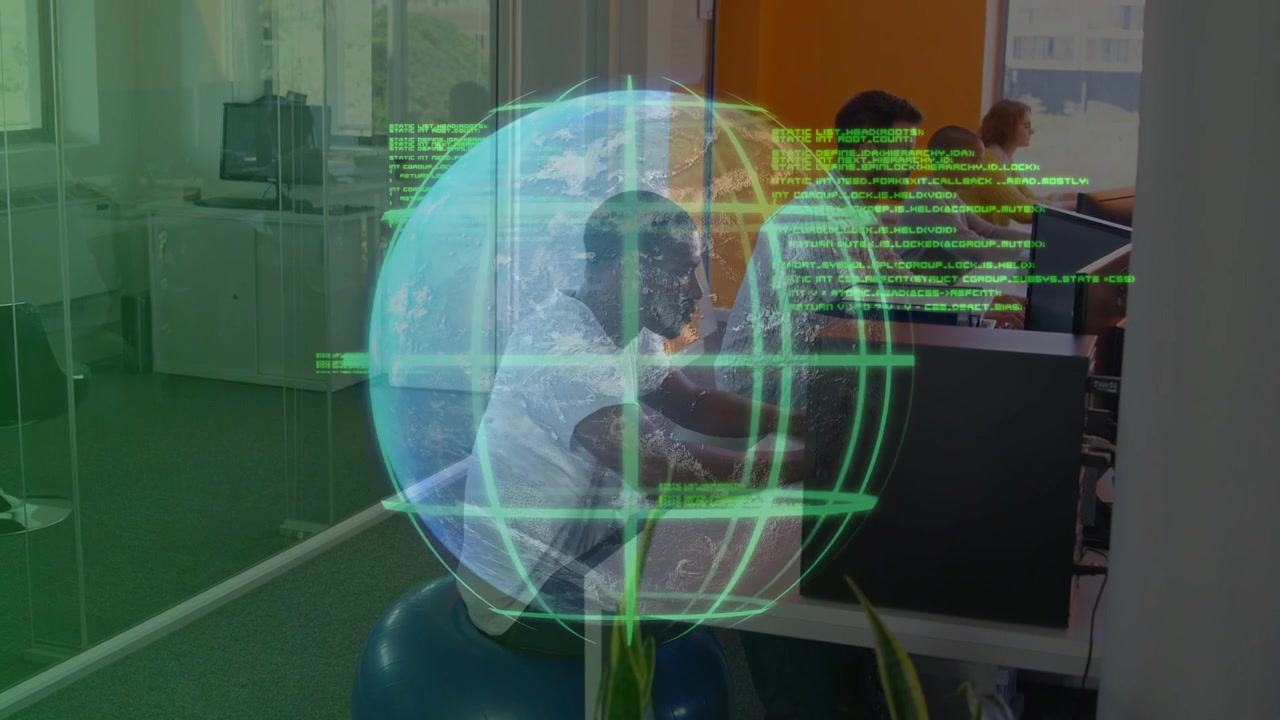 Vertical video: Man on ball typing at tech desk, AR globe with green code overlaying him for review