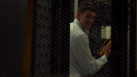 technician using digital cable analyzer on server