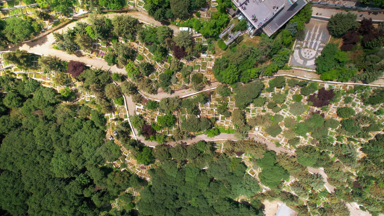 Aerial drone vertical view of Eyup Cemetery in Istanbul, Turkey. Multiple graves and lush greenery